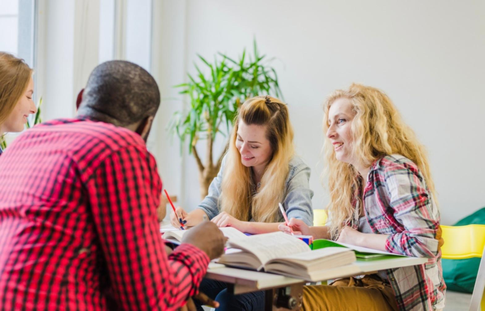 Small group learning session with investment education materials
